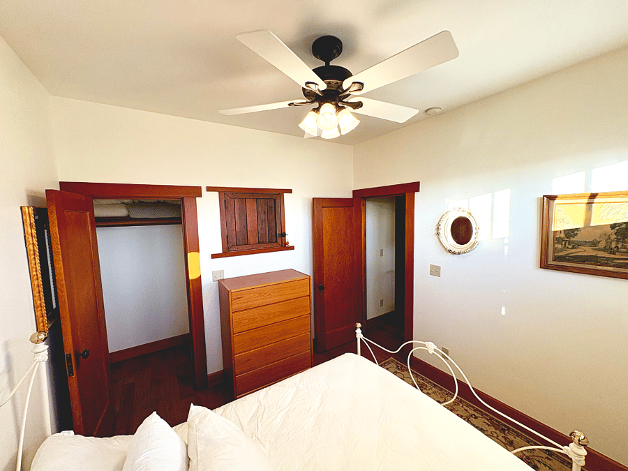 The second bedroom gets its charm from re-purposed architectural details.