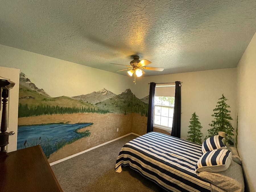 Full Size bed with Walk-in closet with mural and glowing night sky