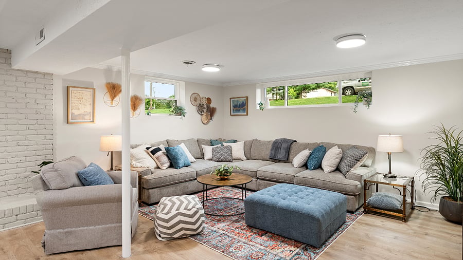 Downstairs living room with large couch and ottoman!