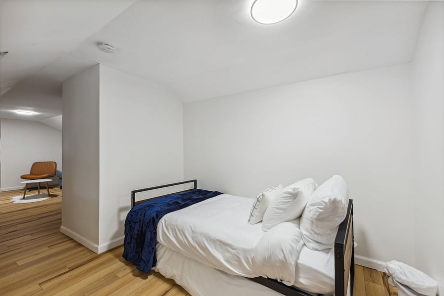 Hallway with trundle bed with 2 twin beds. 
