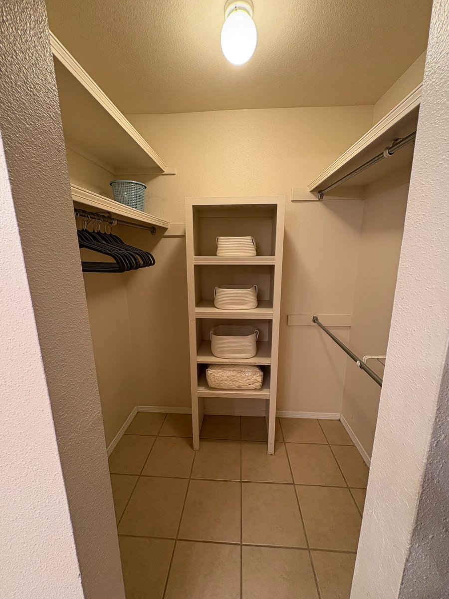 One of two walk in closets in the downstairs master bedroom. There are two walk in closets and are similar.