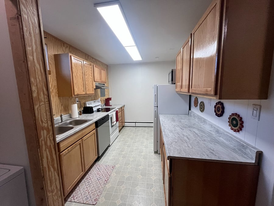 Kitchen has lots of counter space and great light. 