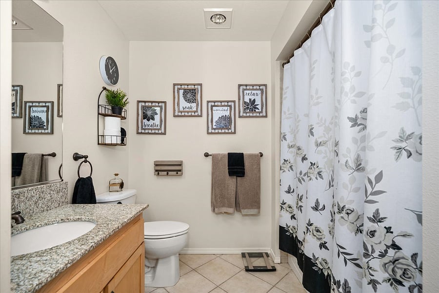 Bathroom including tub and shower