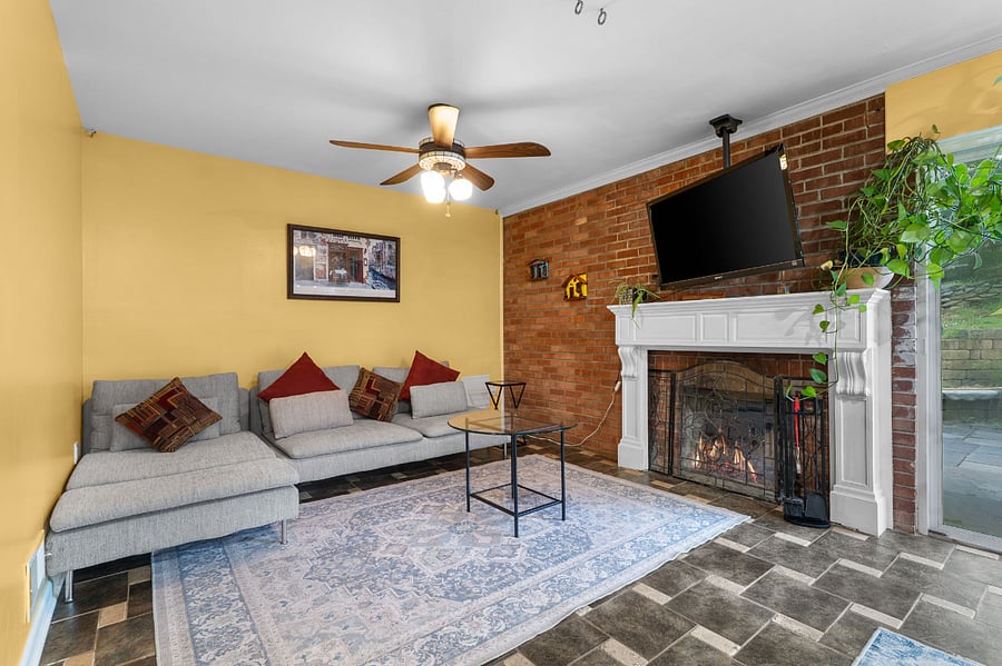 Family room with indoor fireplace.