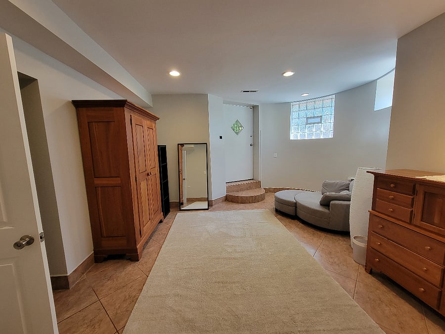 The primary suite includes this dressing area, with a full-sized wardrobe and dresser to complement the storage in the bedroom.