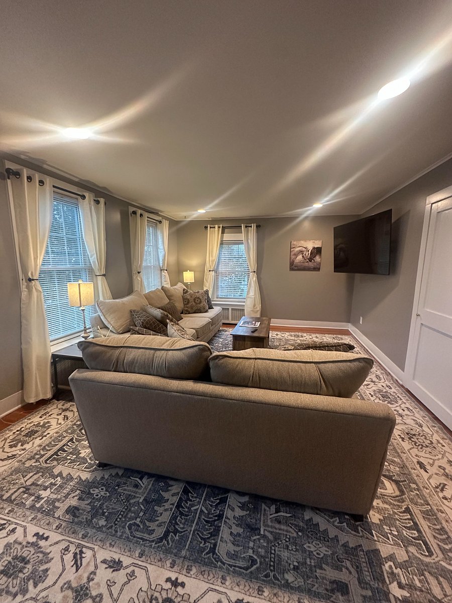 Large living room with plenty of seating, smart tv, large coat closet