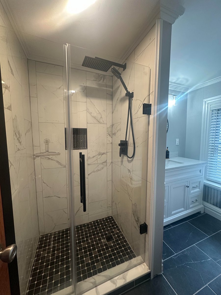 Newly remodeled bathroom with tiled shower and brand new vanity