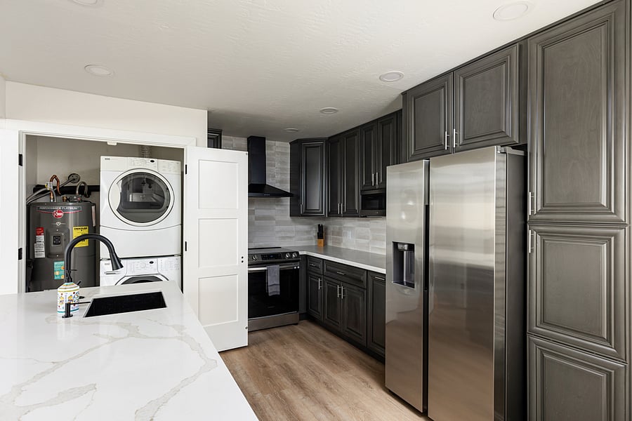 Full size stackable washer and dryer in the unit.