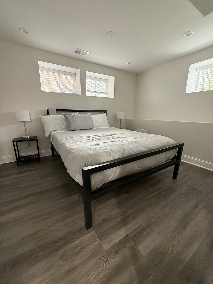 Bedroom 2 features a contemporary Room and Board Queen sized bed with down comforter and cotton sheets. Night stands with 3 way adjustable lamps. Large walk in closet with 4 drawer dresser. Hunter Ceiling fan and wall mounted 43 Samsung Smart TV.