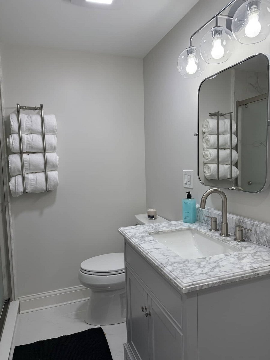 Beautiful marble and stone bathroom with walk in shower. Contemporary West Elm fixtures, oversized bath towels. Hand-soap, Body wash, Shampoo and Conditioner available.