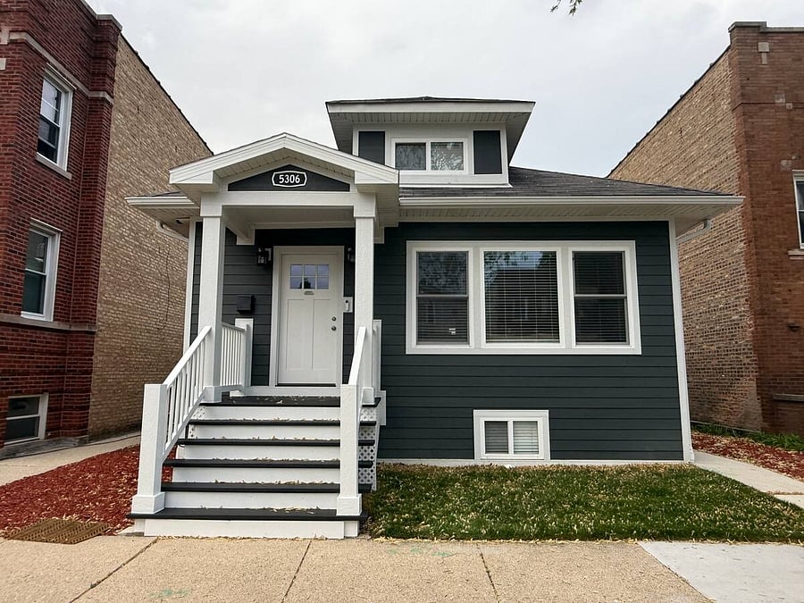 Private entrance to the apartment is at the rear of the house. Proceed down the sidewalk on the right, thru the gate and down the stairs to the private entrance.