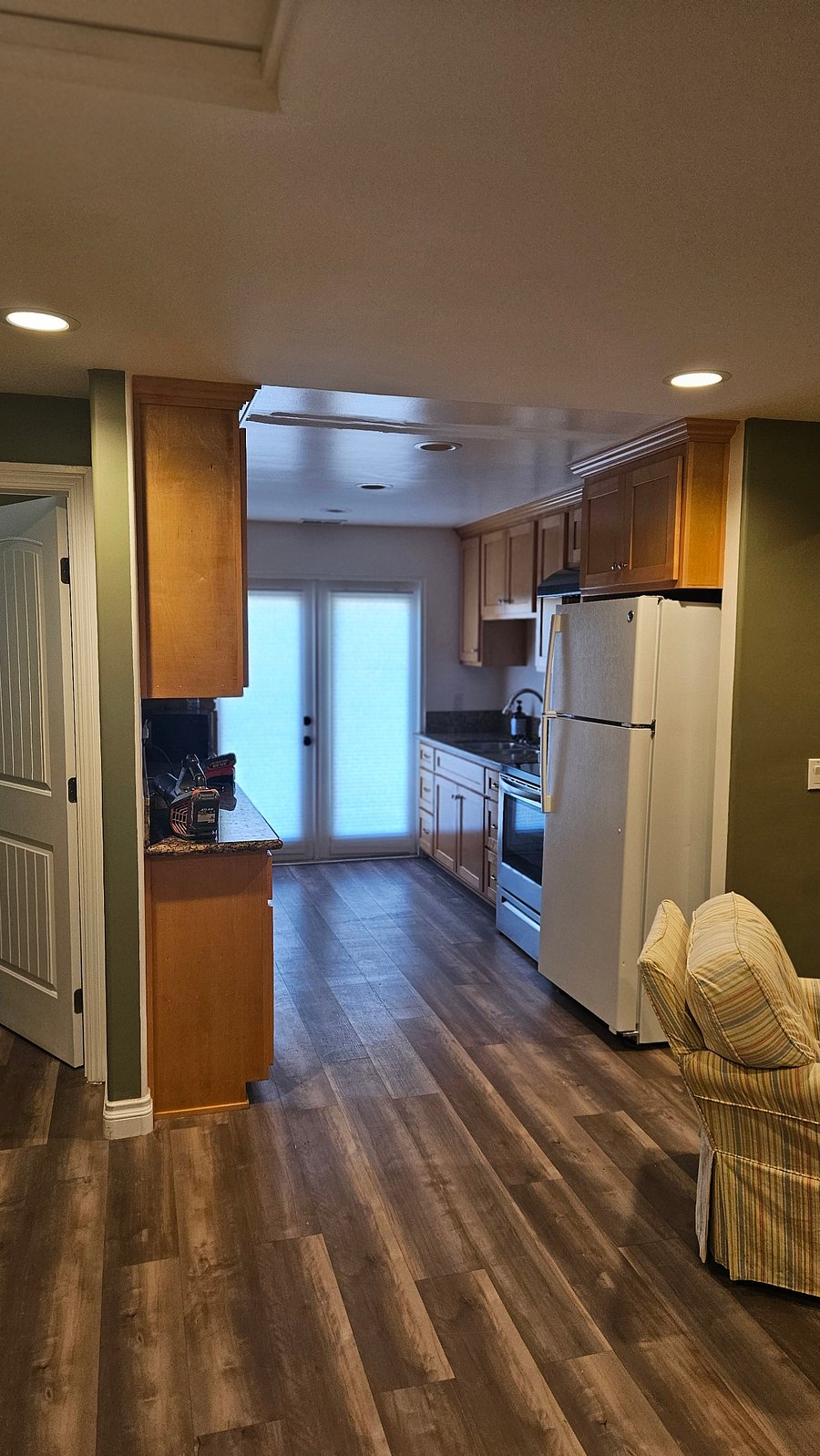 Kitchen with Fridge, Stove, Microwave, and New Garbage Disposal