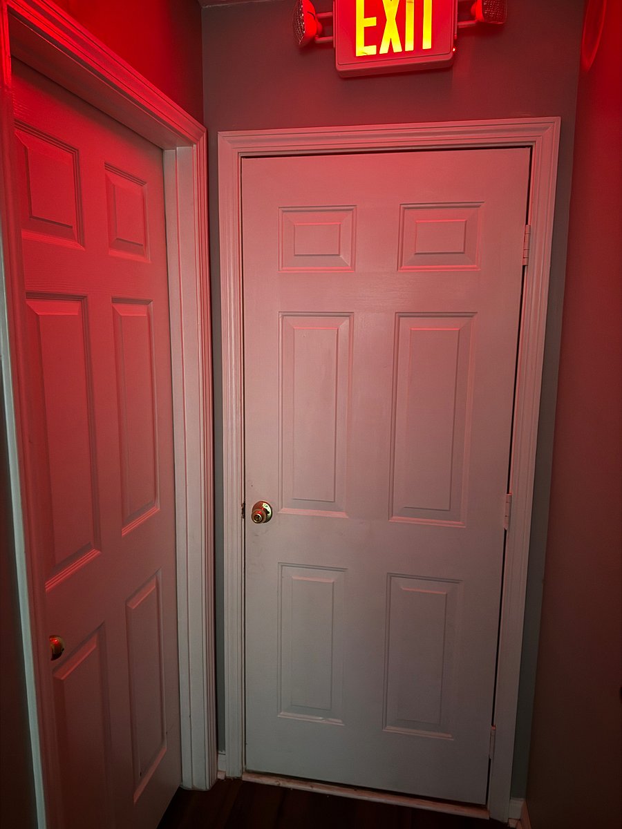 This photo features the bedroom situated right next to the private access entrance.