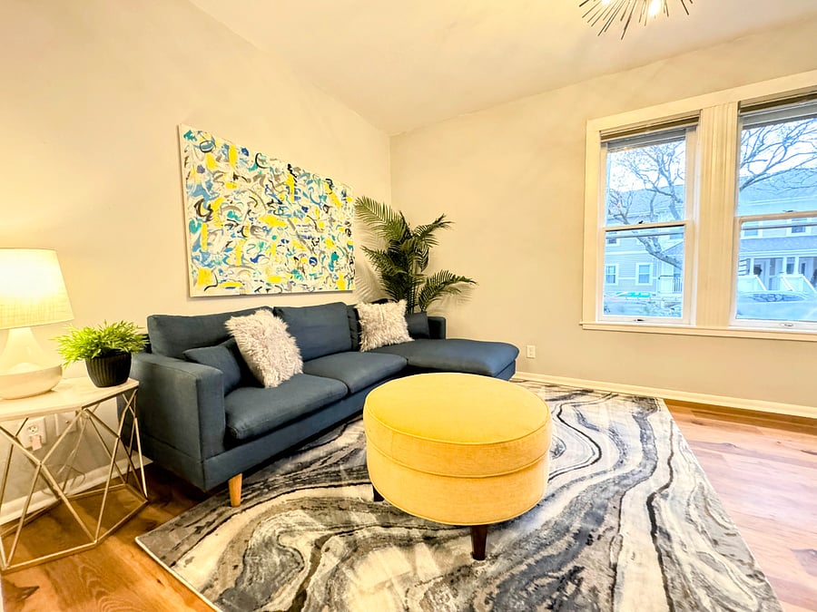 The upper unit has a comfy sectional sofa with plush ottoman, faves the front of the house and the Smart TV