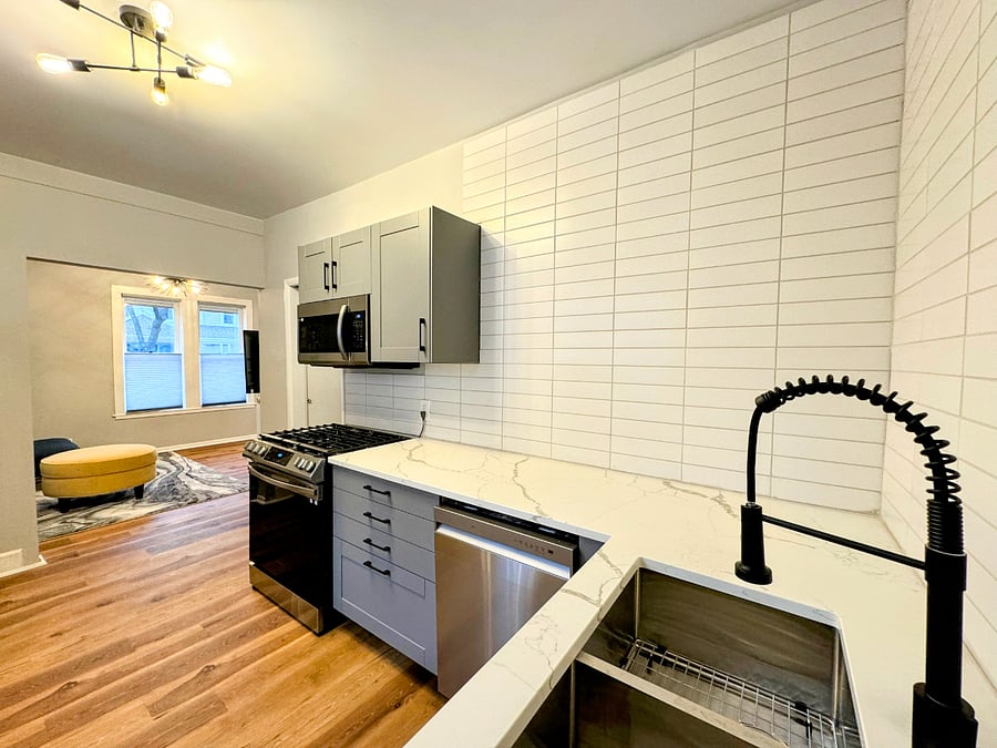 Deep sink with industrial style faucet