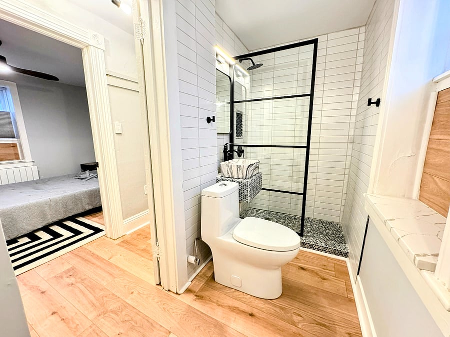 Stunning and spotless bathroom on the lower unit with tile shower, vessel sink and walk in closet areathe