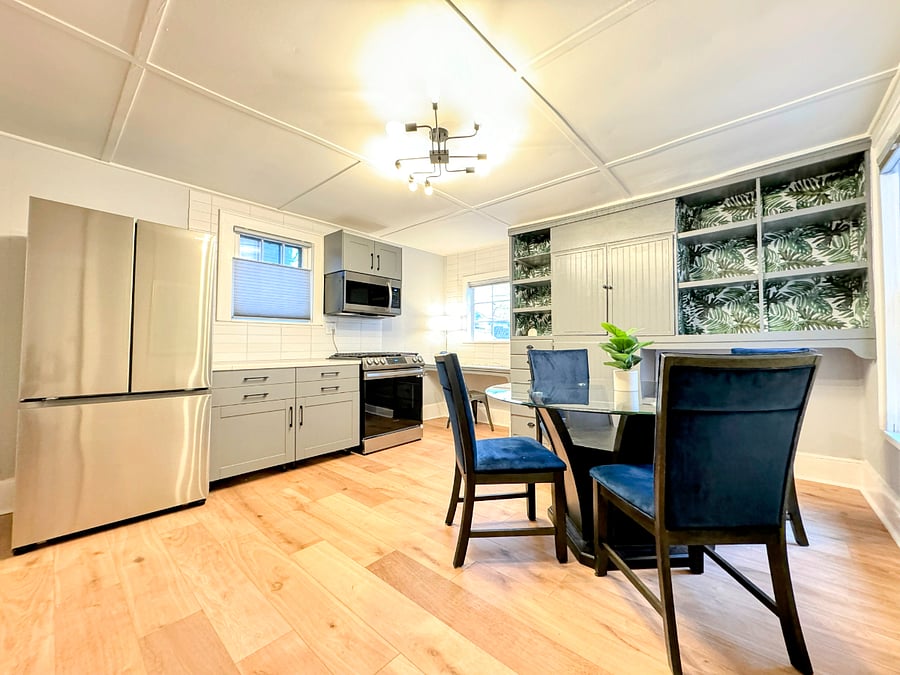 The lower unit has large kitchen space and tons of natural light