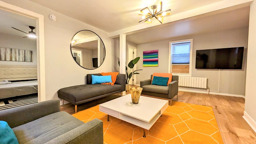 Large living room in the lower unit is funky and clean