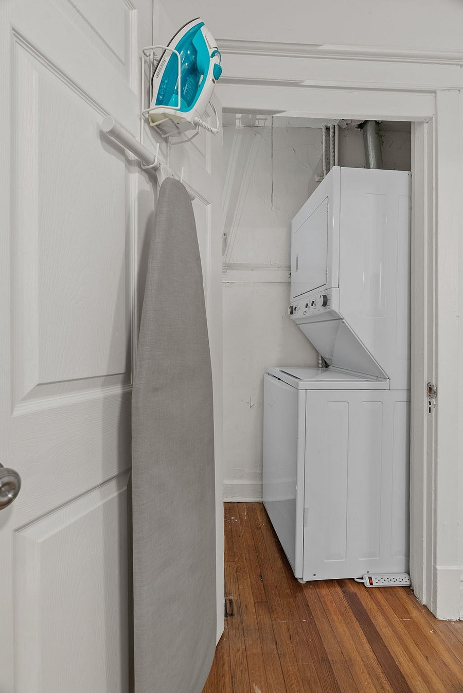 In unit washer dryer with vacuum cleaner, broom, and swifter sweeper. This closet is large enough for luggage and other travel storage