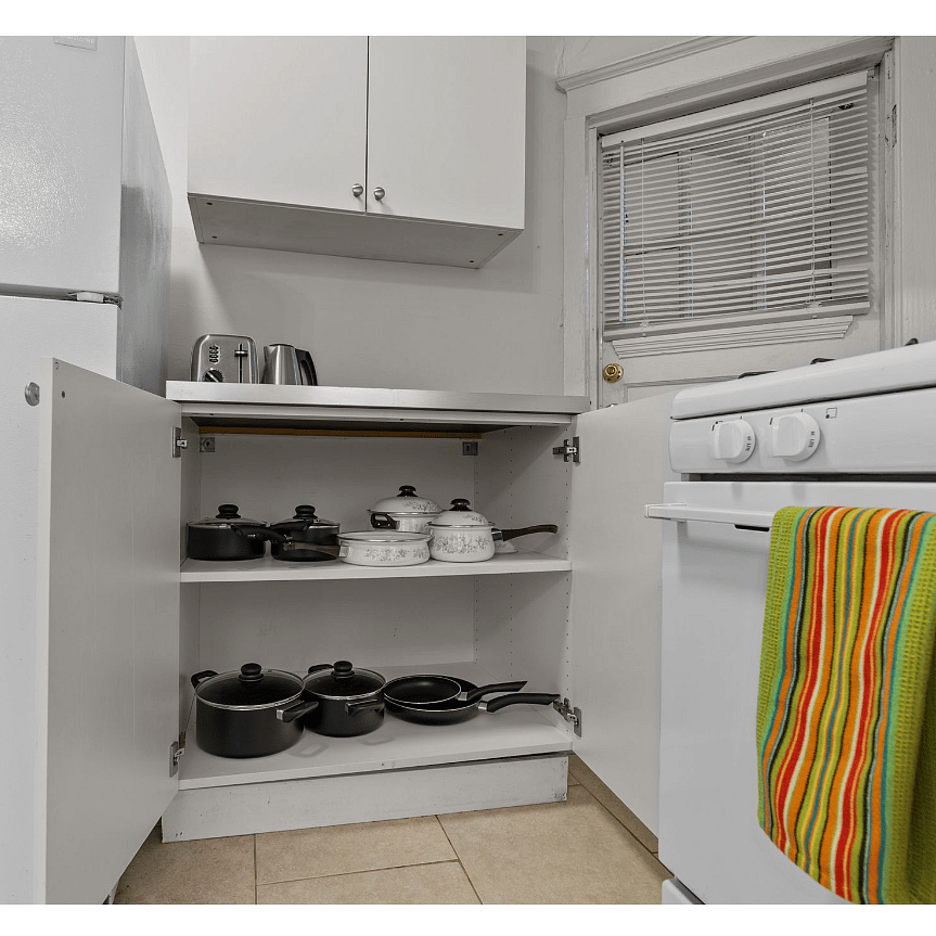 Well stocked kitchen with pots and pans