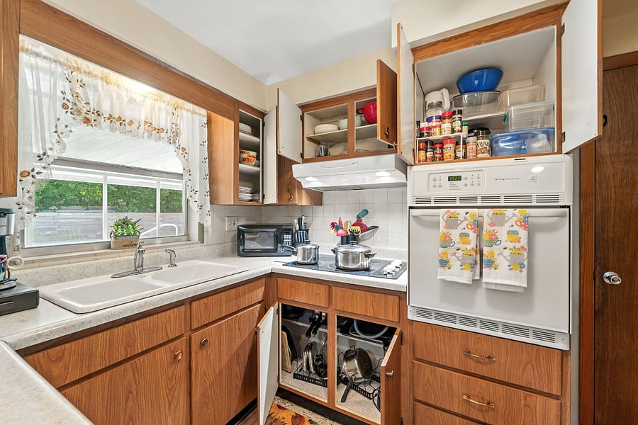 Fully stocked with plates, pots, pans, spices, storage containers, coffee pot, and more!