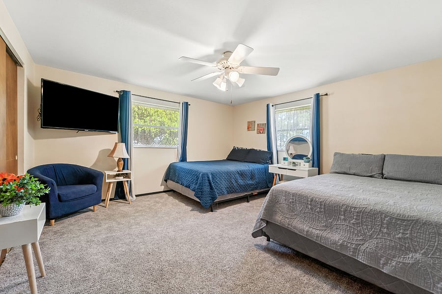 So much room! Mounted TV and reading chair.