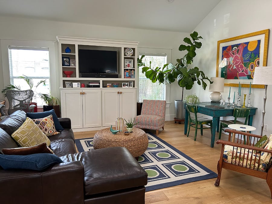 Bright happy living space open to dining and kitchen.