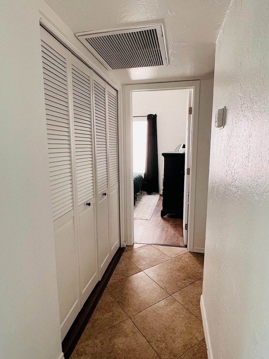 Hallway to guest bedrooms and laundry.