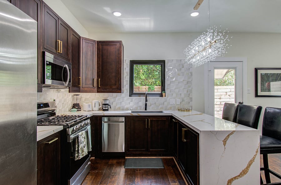 Fully stocked kitchen with all brand new appliances and gas cooking range