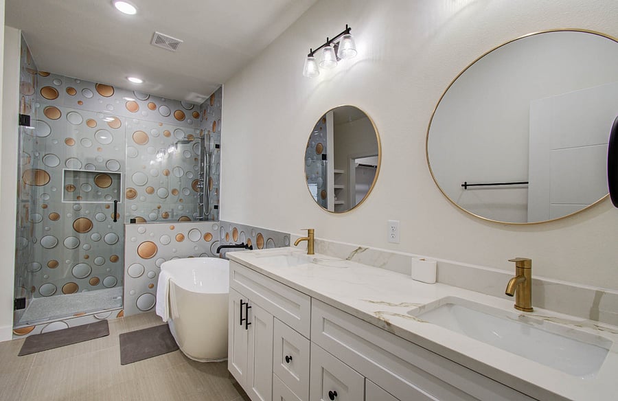 Double vanity with Quartz countertop, soak in tub, and a standing shower with jacuzzi sprayer and rain shower panel