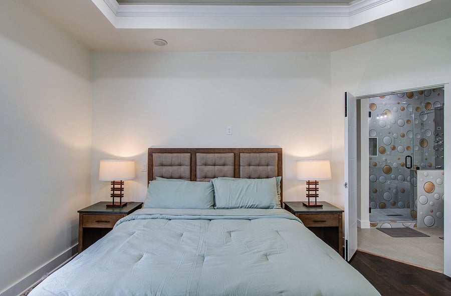 Most comfortable and plush king bed with stone top night stands and armoire