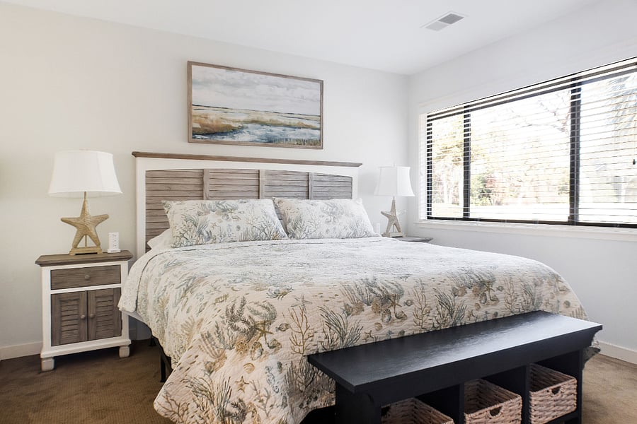 Bedroom with King bed and 50 inch Smart TV and workspace desk.