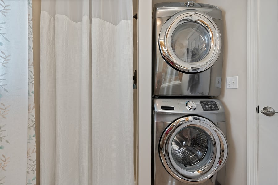 full bath with stack laundry on first level