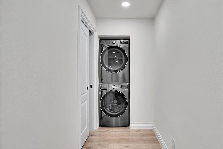 New washer and dryer next to guest half bath