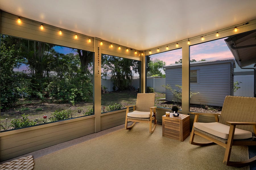 Enjoy the Florida sunsets from your screened in back porch, which includes rocking chairs, a bug zapper and wall-mounted oscillating fan to provide a breeze on warm evenings. 
