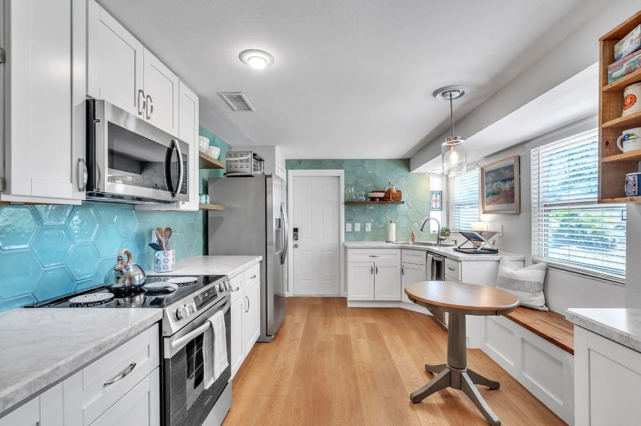 This kitchen is generously stocked with cooking supplies to delight any Foodie! In eat-in area is great for coffee and breakfast. The coffee bar provides drip coffee, French Press coffee, Cuba stovetop Coffee and a delightful collection of fun coffee cups! Pantry is located behind fridge. 