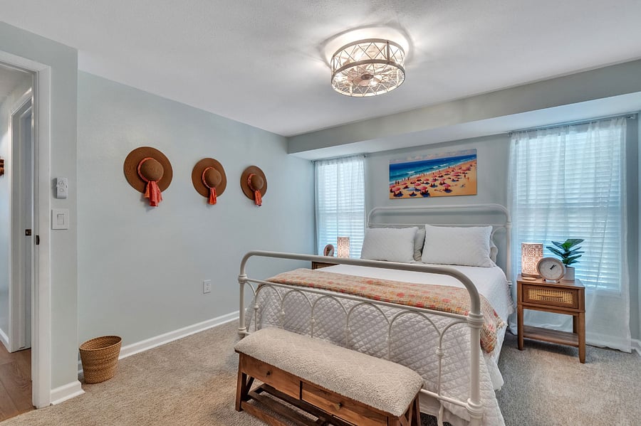 Guest Bedroom with Queen sized Sealy Posturepedic Mattress. Spacious closet on opposite wall, full sized wooden dresser, smart TV, room-darkening curtains also available in closet. 