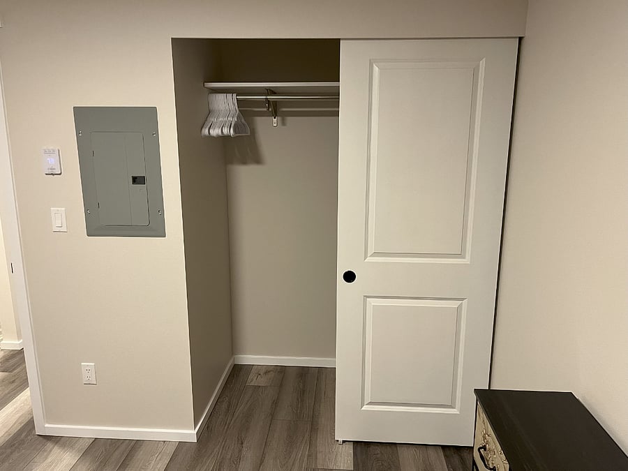 Bedroom closet with hangers.
