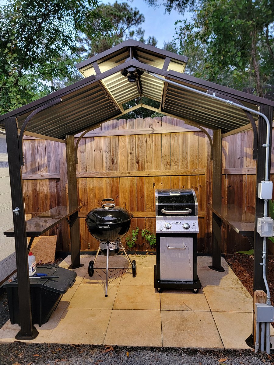 Choice of gas or charcoal grill with motion sensor lighting