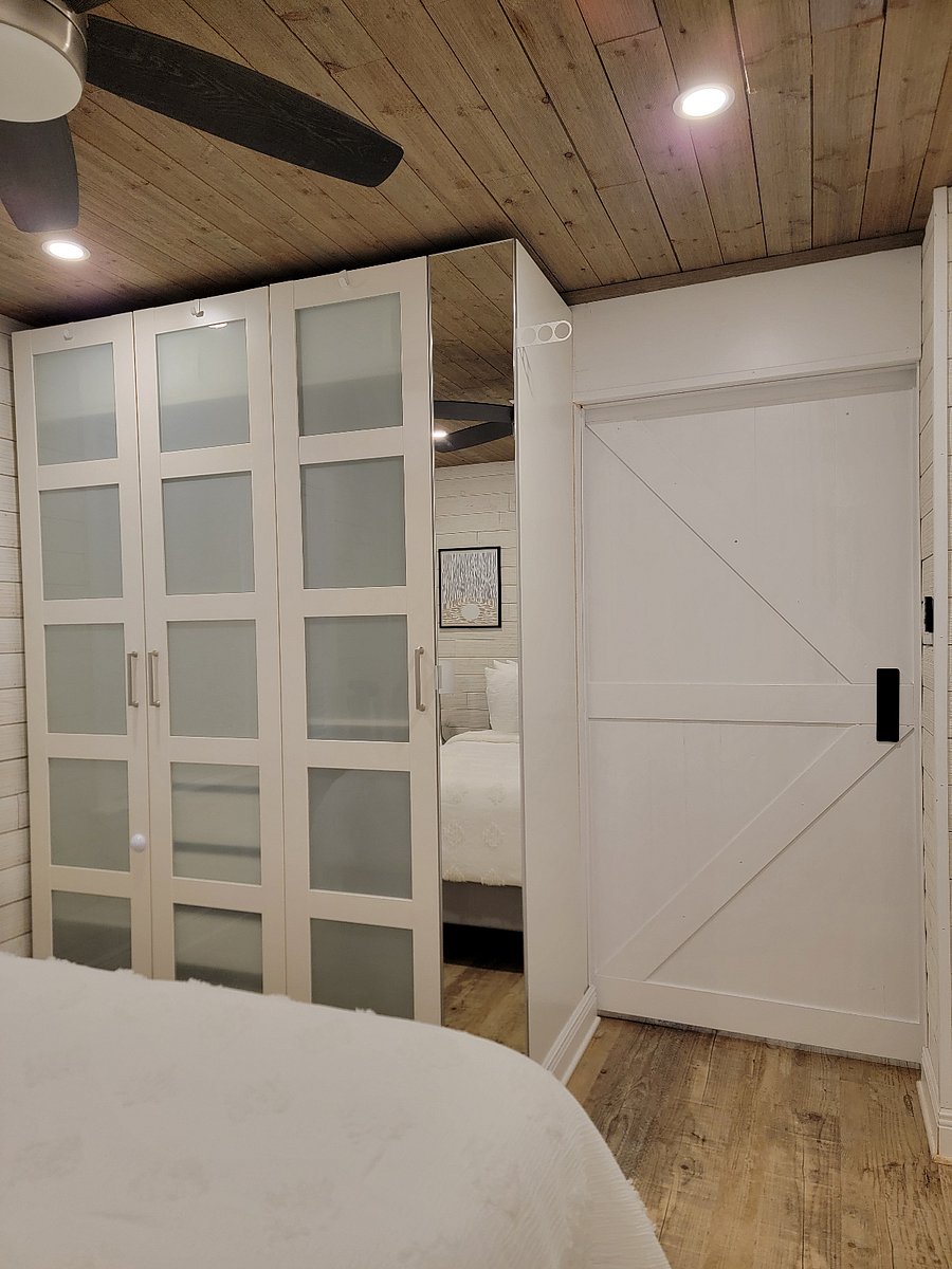 Armoire closet in each bedroom with lots of storage and full length mirror