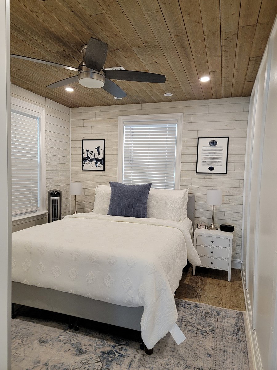 Bedroom 1 with direct access to screened porch