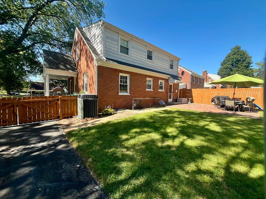 The wooden gate goes out to the rest of the driveway and down to the street where parking is available. The gate along the back of the house is where you can go down the stairs to your own private entrance.