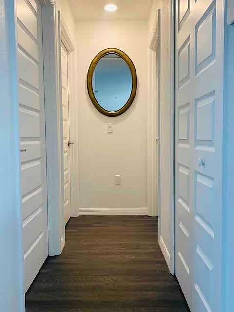 Hallway to guest bathoroom and two bedrooms