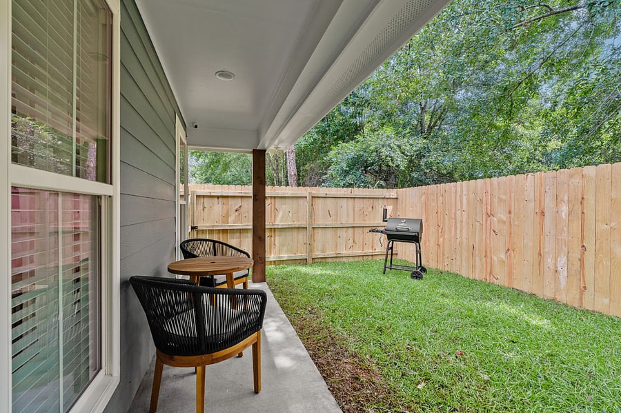 Outdoor patio with grill and seating