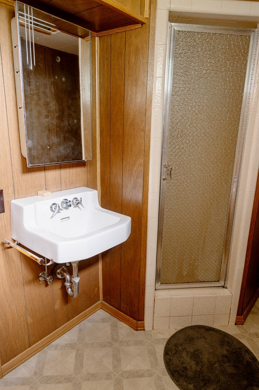 Downstairs bathroom - small bathroom with a shower.