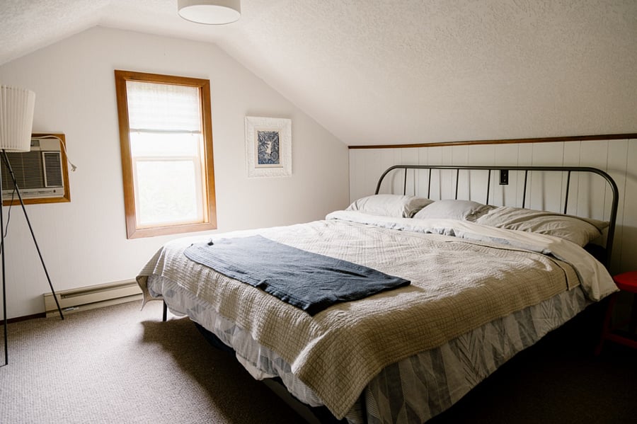 Main Bedroom on 2nd floor.  Occupied with a King sized bed and AC unit.