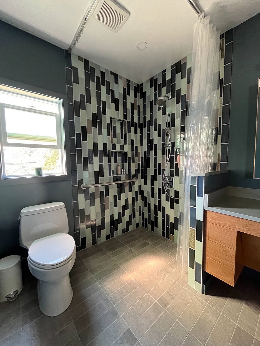 Main Floor Bathroom: Stylish newly-remodeled bathroom that was designed with accessibility in mind. 
