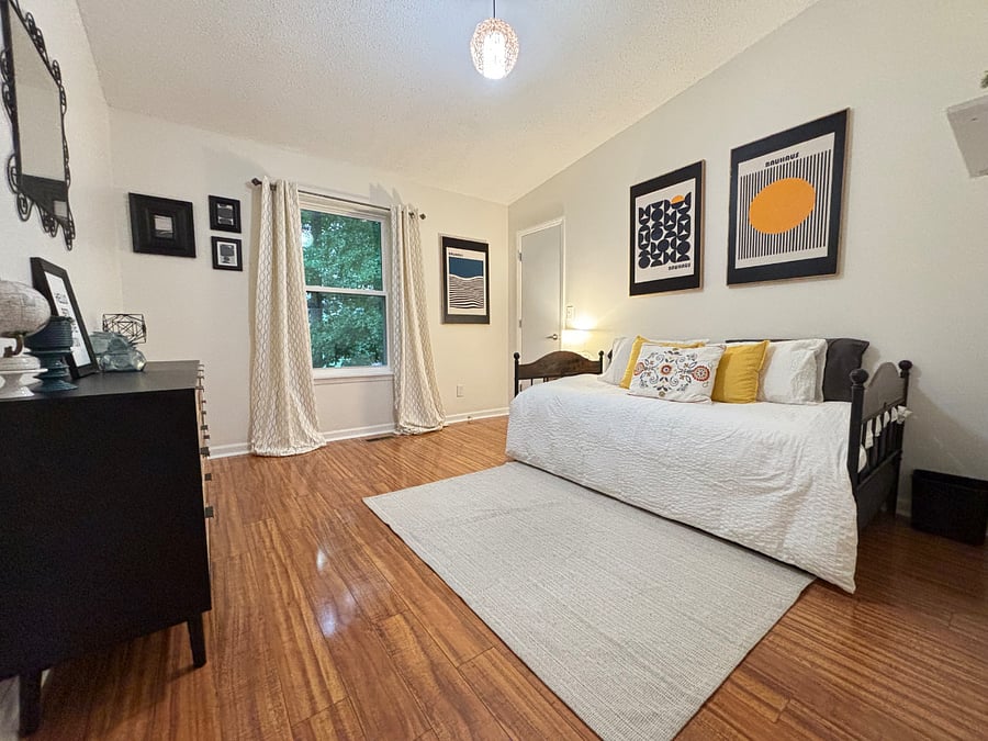 Flexible space including a trundle bed with 2 twin mattresses that can combine to make a King size bed. King sheets available if desired. Walk in closet.