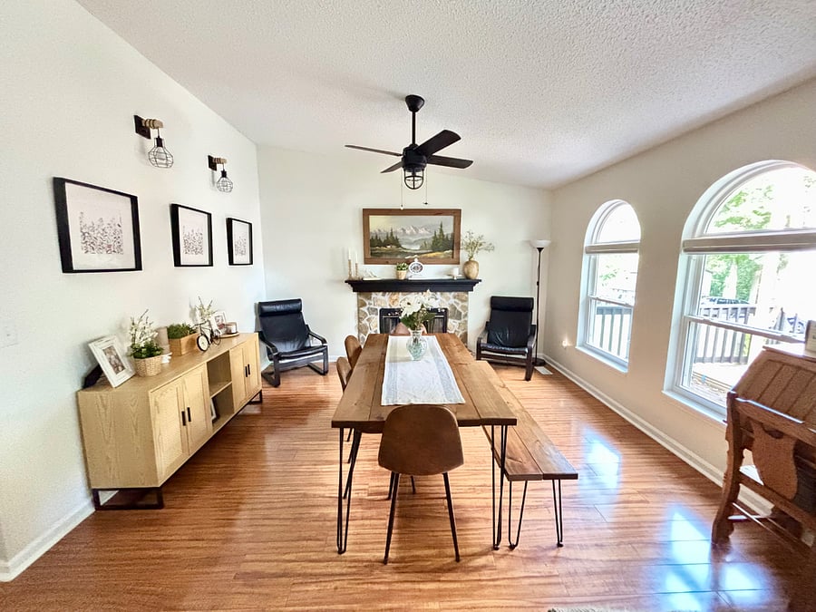 Open dining room with natural gas fireplace. Keep the shades open for the lighting or close them when you want some privacy.