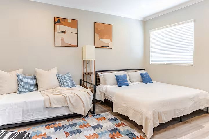 Master bedroom with a small balcony leading outside.  This room can sleep four with one king size bed, a twin trundle (a twin bed on the top and a pull out twin bed below) with lots of extra moving space.  Room is locate upstairs. 